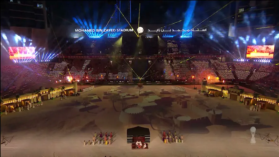 The 60-metre fort set piece lit in warm tones across the pitch before kick-off