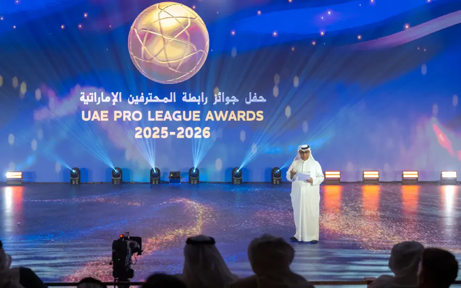 A presenter in front of the main LED screen carrying the UAE Pro League Awards 2025-2026 title